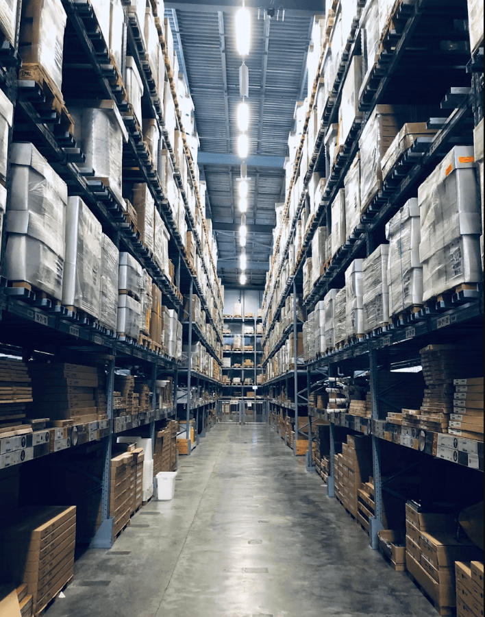 Organized warehouse racking with boxes ready for fulfilment